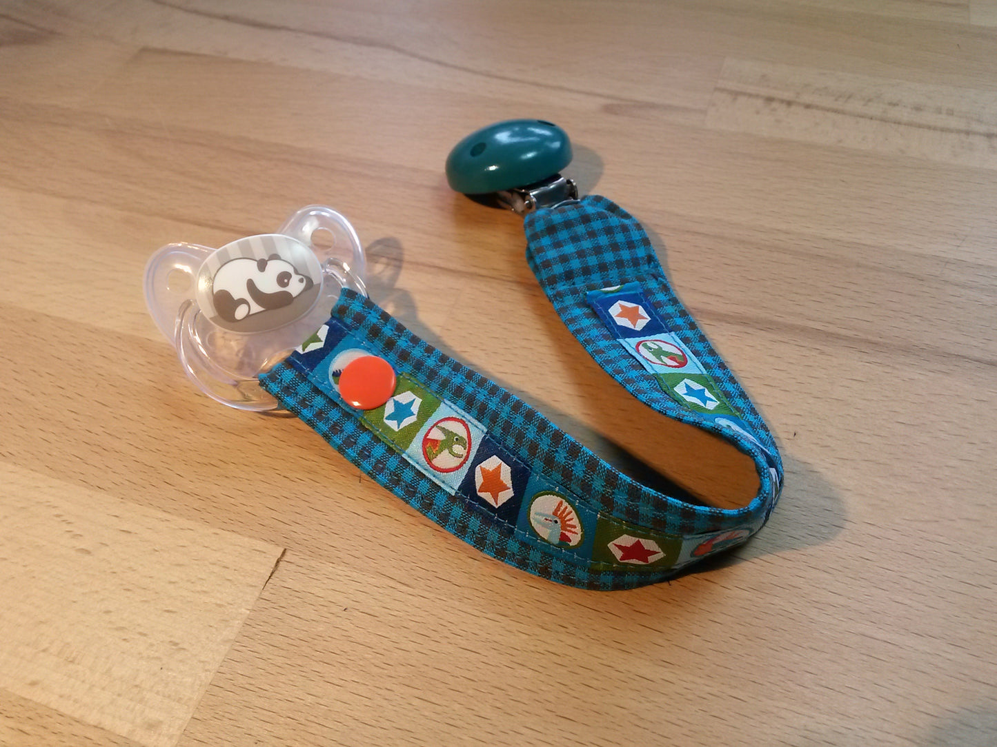 Schnullerband türkis-braun + Dinoband