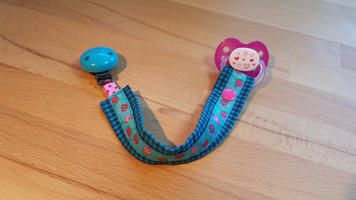 Schnullerband türkis-pink + Blümchenband